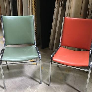 Retro chrome stackable chairs in fabulous orange and green. 