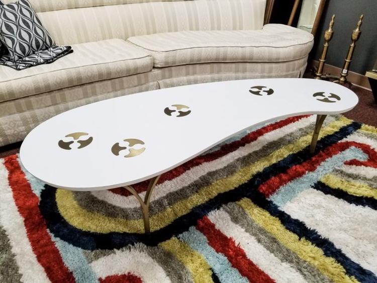 Mid-Century Modern amorphic coffee table with brass inserts and legs