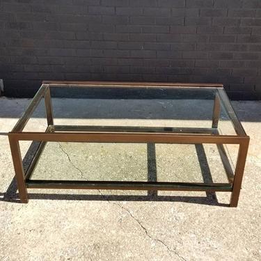 Metal and glass two tier coffee table. (Minor scratches on glass) 44" wide, 22" deep, 17" height 