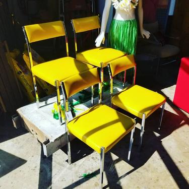Set of 4 canary and chrome chairs. $250