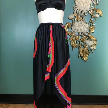 1970s maxi skirt, asymmetrical, vintage swim cover, Elizabeth Stewart, rainbow print, size small, black nylon, wrap skirt, hi-lo, tropical 