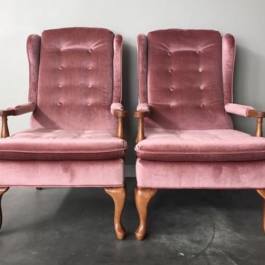 pair of vintage wingback chairs in plush pink.