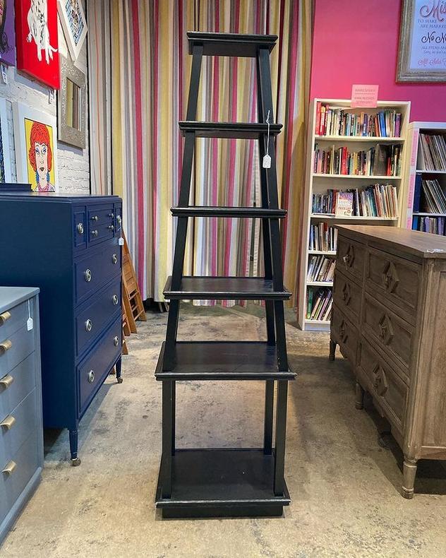 Black painted etagere. 68.5” tall. Base is 20” wide. 