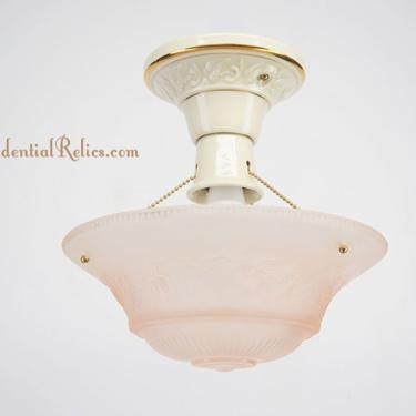 Ceramic 3-chain ceiling fixture with pink glass shade, circa 1940s