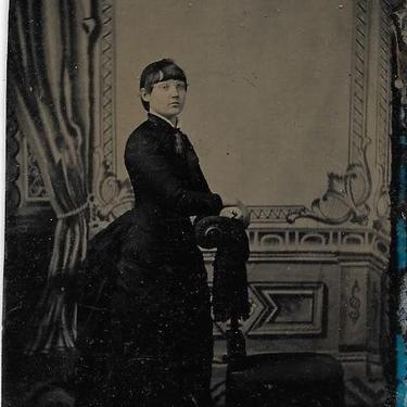 Tintype Photograph of a Woman Resting Her Hands on a Chair 