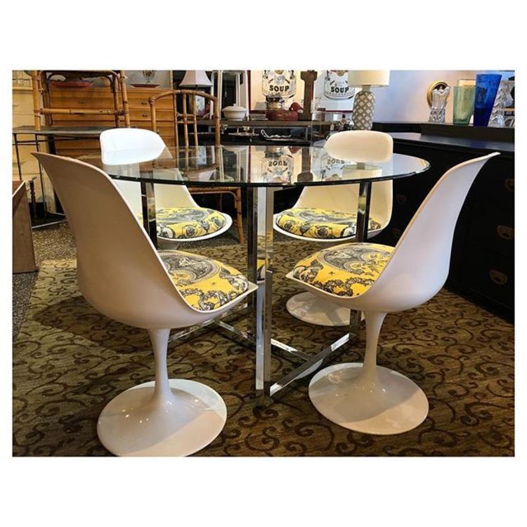 Fab Chrome base round glass table 48” round / 29.5” tall White swivel tulip style chairs