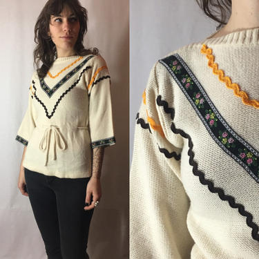 Vintage 1970s Folk Sweater | Acrylic Ric Rac and Embroidered Ribbon Appliqué Pullover, Tie Waist Peplum Knit Top | Collage 