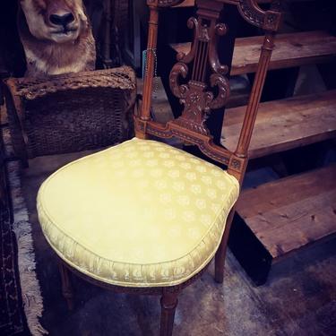 Antique upholstered lady's chair. $125