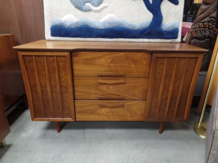 Mid-Century Modern walnut credenza with sculpted fronts