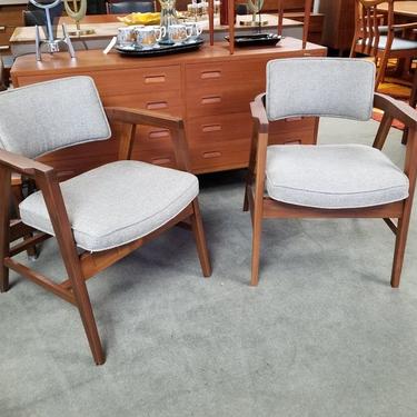 Pair of Mid-Century Modern walnut armchairs with new upholstery by Gunlocke