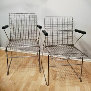 Pair of Mid Century Modern Chrome Wire Grid Stacking Chairs. Postmodern, Shopping Cart Chairs, Designer Style Chairs Black Armrests 