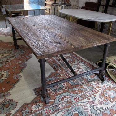 RUSTIC WOOD AND IRON INDUSTRIAL COFFEE TABLE ON CASTERS