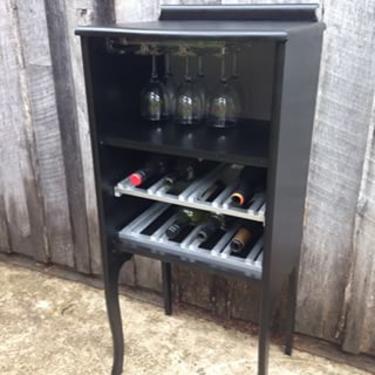 Wine bar made from an old sheet music cabinet. Includes 6 glasses and makes an awesome wedding gift! 18w 14d x 40h. $125