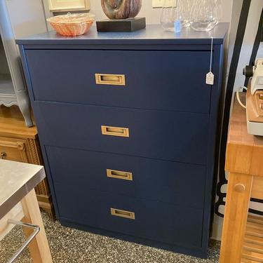 Navy blue painted chest of drawers with brass pulls. 33.5” x 18” x 43”