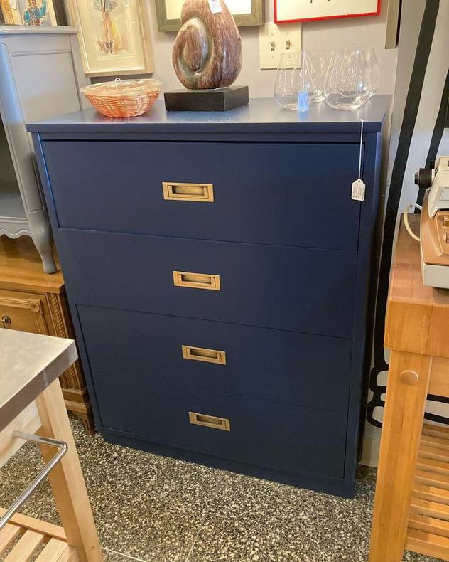 Navy blue painted chest of drawers with brass pulls. 33.5” x 18” x 43”